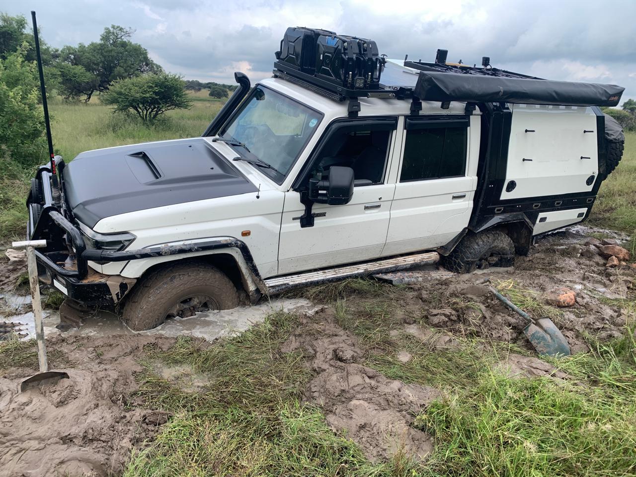 Land Cruiser 76 cresting a dune in soft sand